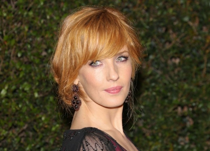 Kelly Reilly wearing her hair in a loose up-style