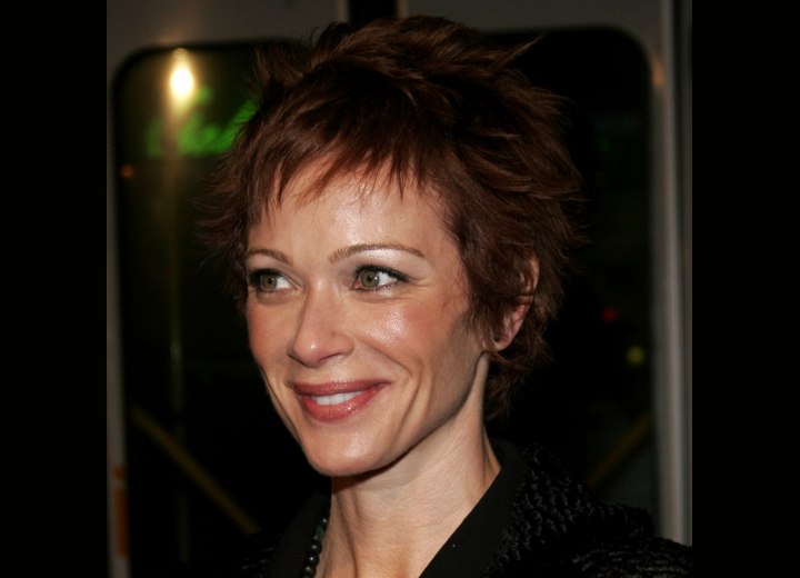 Lauren Holly sporting a short pixie haircut