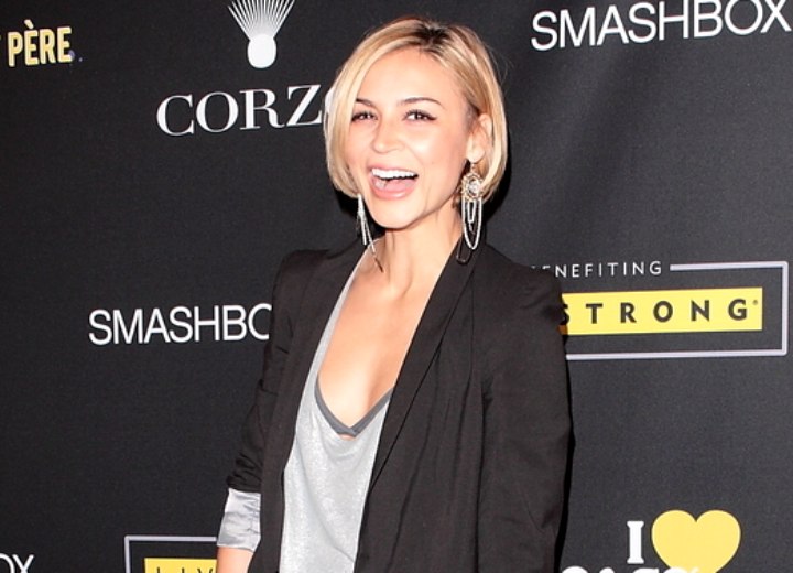 Samaire Armstrong wearing long leather boots