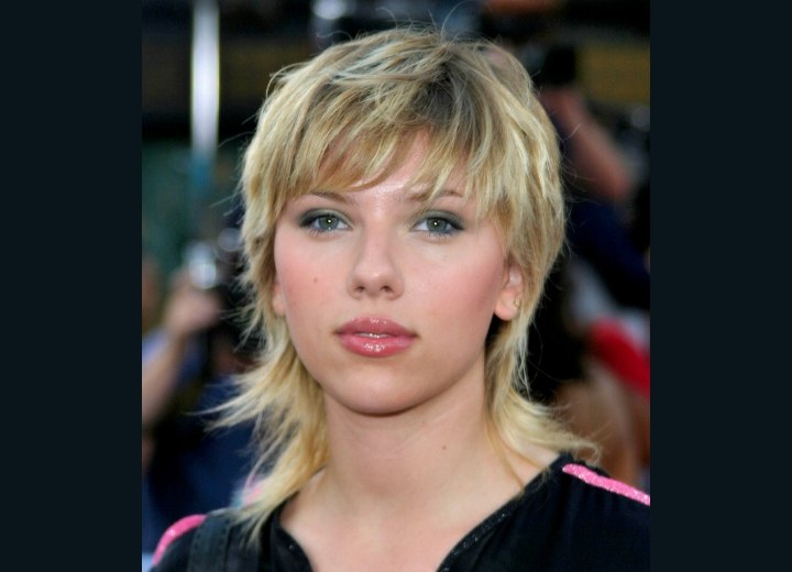 Scarlett Johansson with her hair cut in a long shag with razor spliced ends