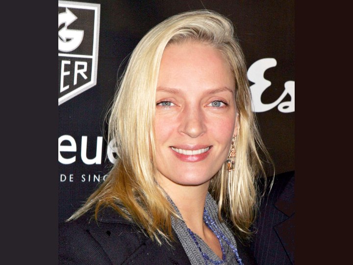 Uma Thurman wearing her hair cut in chops and smoothed down to suit today's 