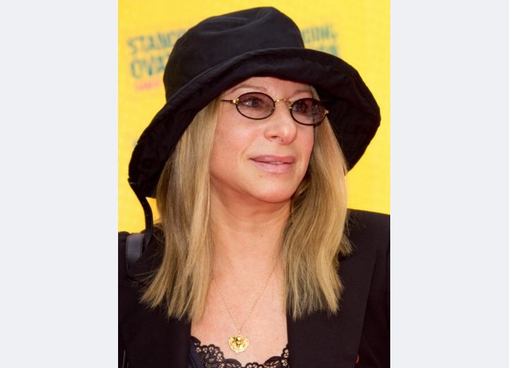 Barbara Streisand with long hair and wearing a hat