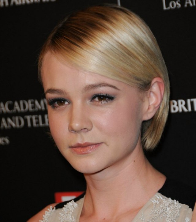 Carey Mulligan wearing an easy to take care of bob with hair tucked ...