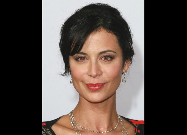 Catherine Bell wearing her hair pulled back and out of her face