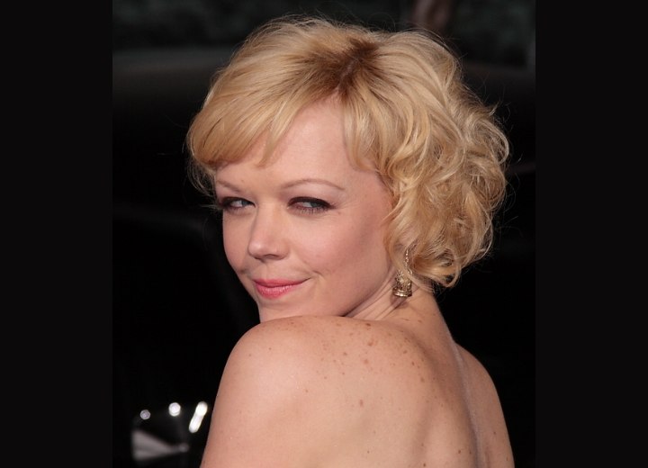 Side view of Emily Bergl's short curly hairstyle