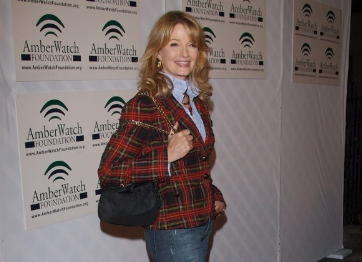 Deidre Hall wearing a blouse with the collar turned up