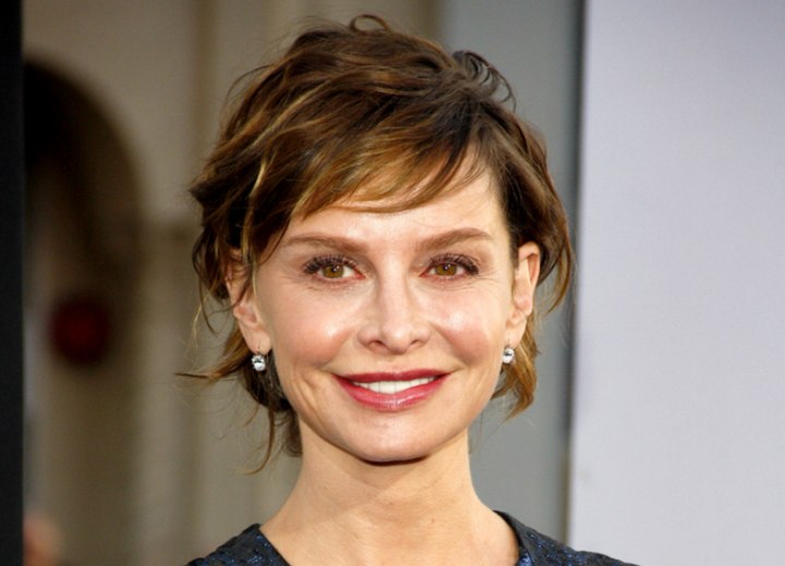 Calista Flockhart with her hair swept back in an updo