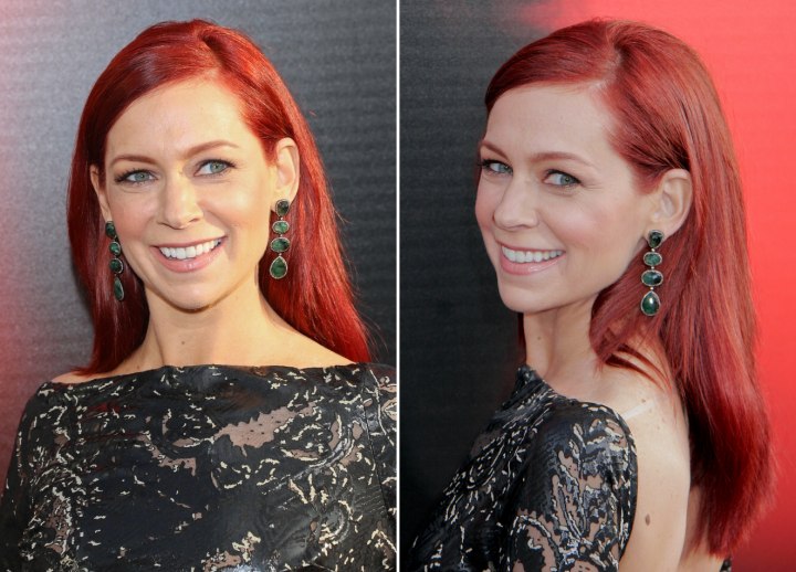 Carrie Preston's hairstyle with her hair tucked behind her ears