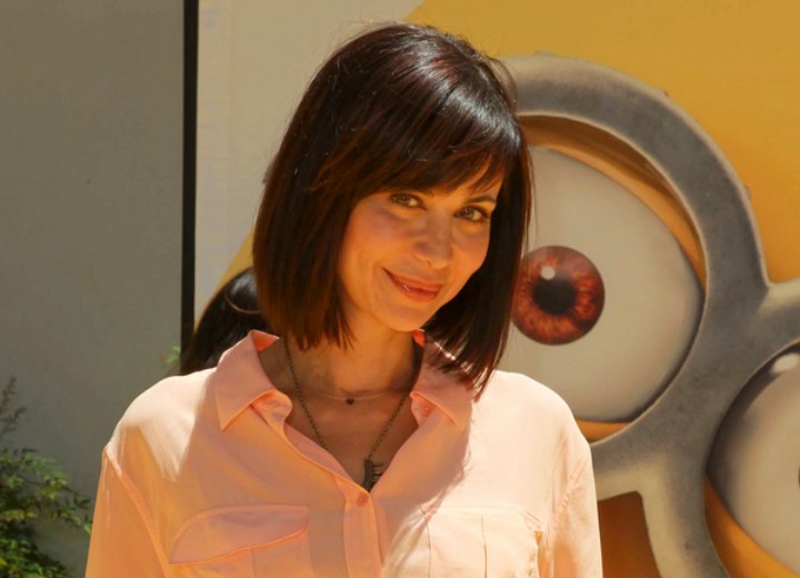 Catherine Bell wearing a bob hairstyle that is longer in front