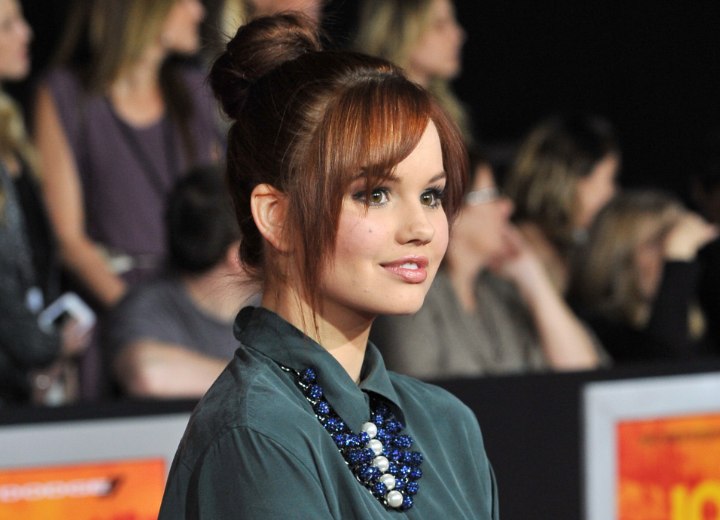 Debby Ryan wearing her hair up and away from her collar