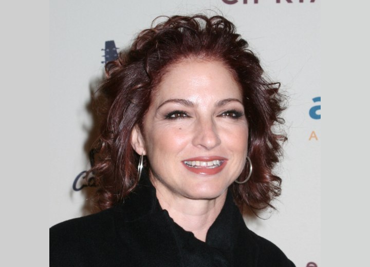 Gloria Estefan - Hair color with depth and red highlights