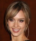 Jessica Alba with her hair pulled back into a knot