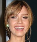 Jessica Alba's hairstyle with a nape area knot