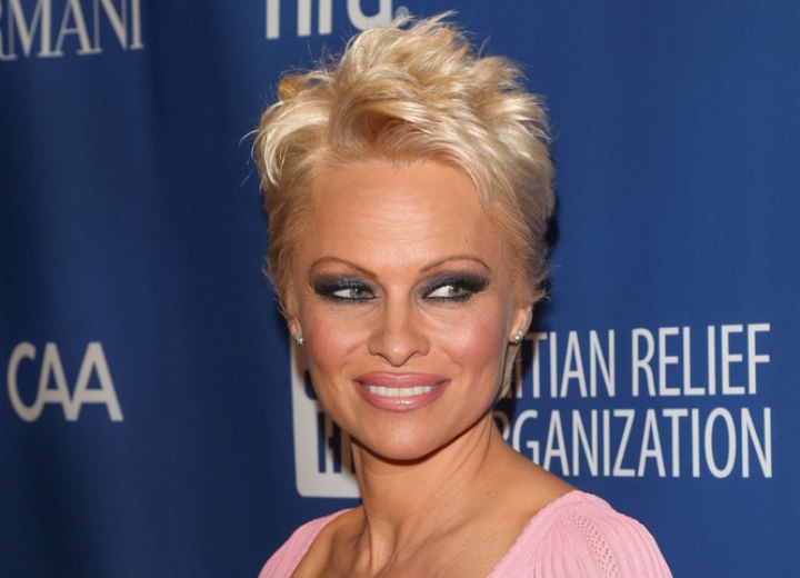 Pamela Anderson with her hair cut in a pixie