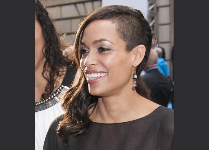 Rosario Dawson with the side of her head shaved