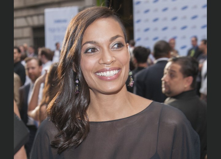 Rosario Dawson's long hairstyle with a shaved side