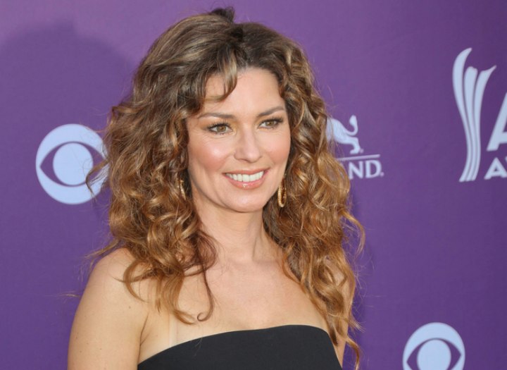Shania Twain in her late forties and with long hair