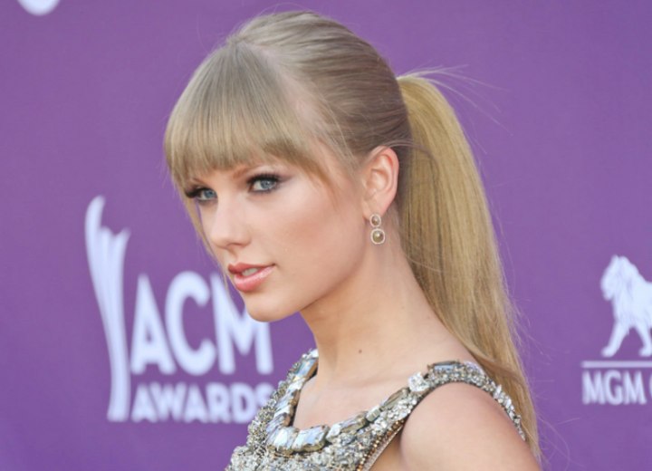 Taylor Swift  with bangs and a high ponytail