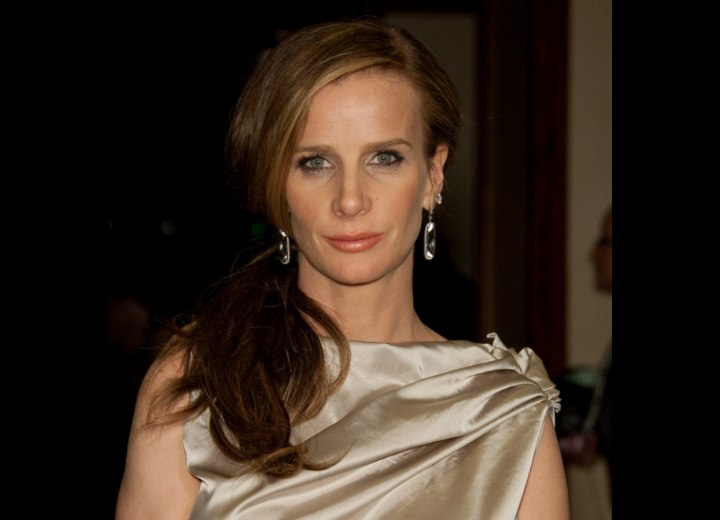 Rachel Griffiths with her hair styled in front of one shoulder