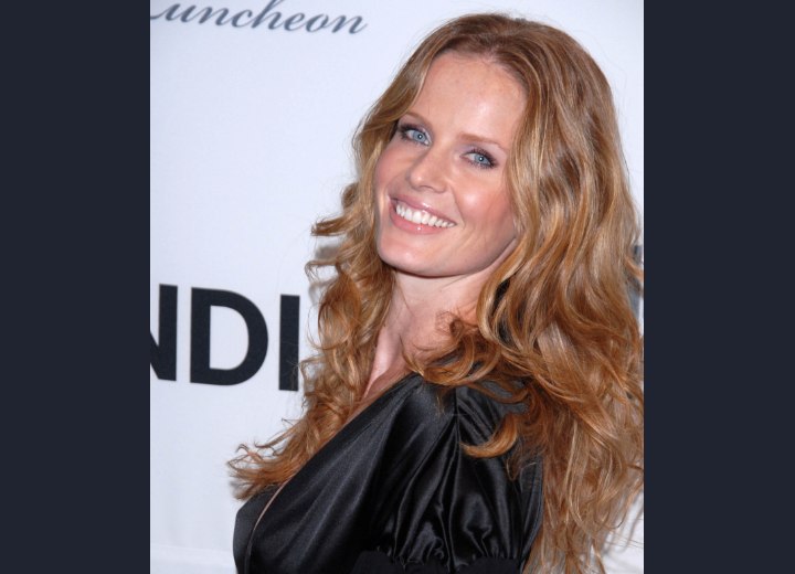 Rebecca Mader wearing her hair long with bouncy curls