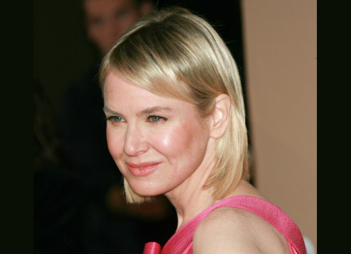 Renee Zellweger with her hair styled behind one ear
