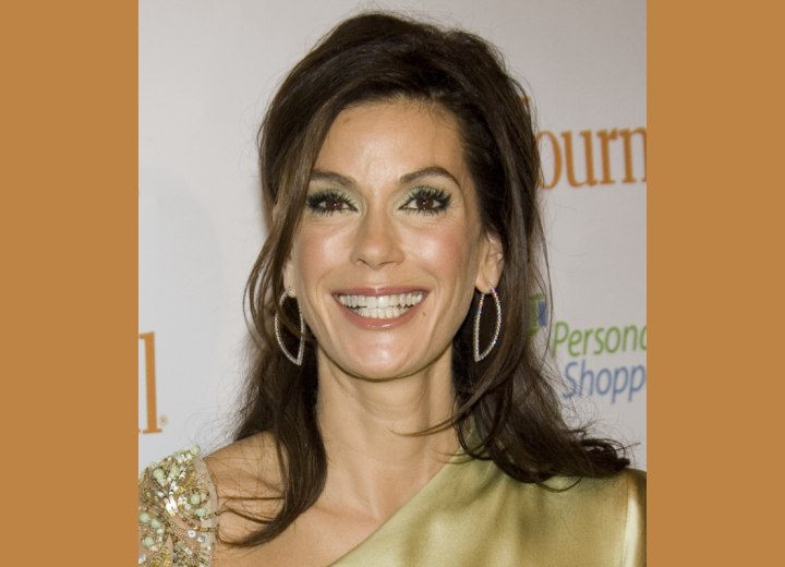 Teri Hatcher wearing her hair gathered in the back
