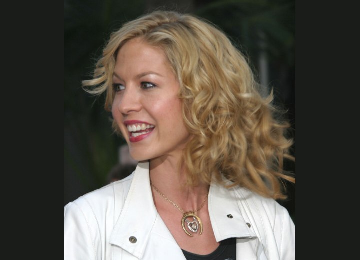 Jenna Elfman with curly layered hair