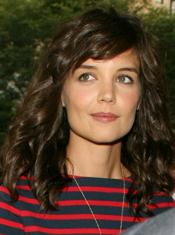 Katie Holmes with long coiled hair that has a healthy sheen