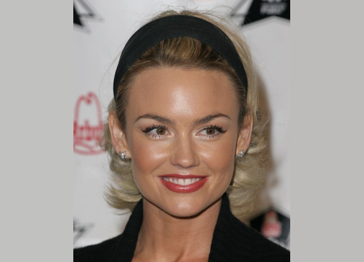 Kelly Carlson wearing her hair pulled back