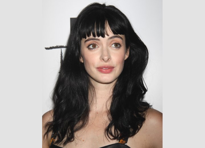 Krysten Ritter's long hair with ruffles on the ends