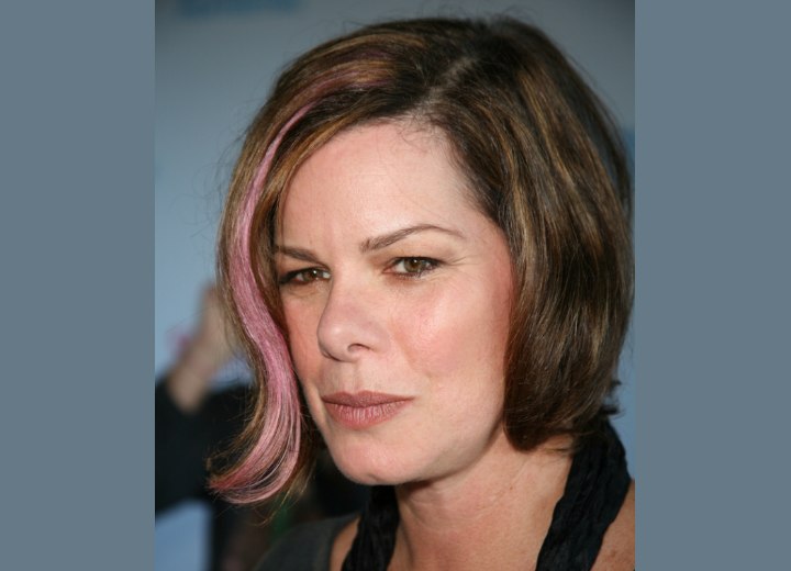Hair with a pink strand - Marcia Gay Harden