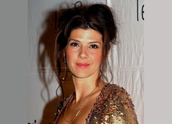 Marisa Tomei wearing her hair up with a loose bun