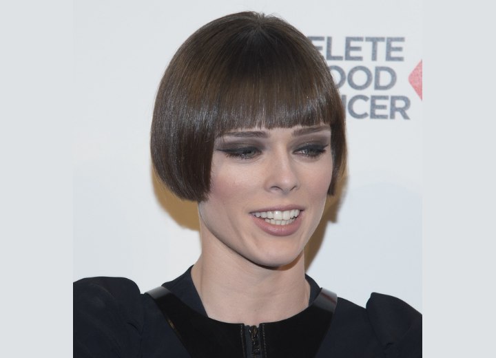 Coco Rocha wearing her hair very short and with a smooth finish
