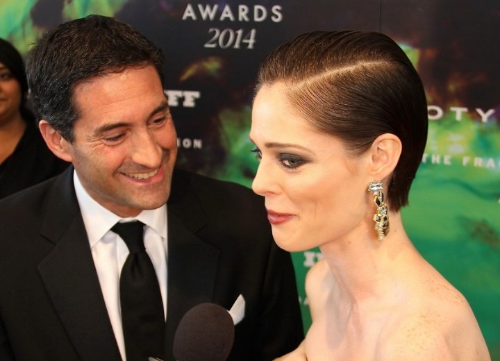 Side view of Coco Rocha's slicked back hair