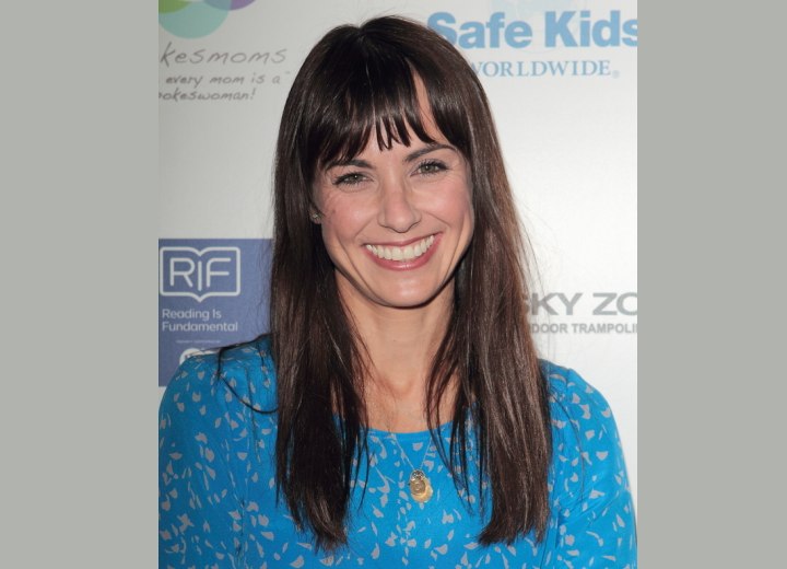 Constance Zimmer with long hair and perfectly cut bangs