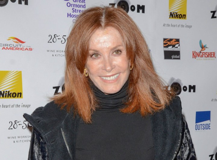 Stefanie Powers wearing a turtleneck to camouflage wrinkles