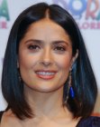 Salma Hayek's long bob with a middle part and one side combed behind her ear