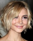 Samaire Armstrong with her blonde hair cut in a choppy bob