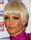Sarah Harding's short haircut with exposed ears and blunt bangs