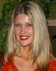 Sarah Lancaster with her hair cut in a long style with tapered sides