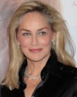 Sharon Stone aged past 50 and wearing her hair long with lots of body and volume