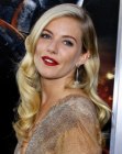 Sienna Miller's long hairstyle with curls that fall below the shoulders