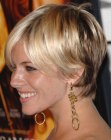 Sienna Miller with her hair cut short in a shag inspired pixie
