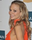 Tamara Braun's curly hairstyle with the hair styled away from her face