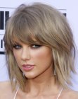Taylor Swift's above the shoulders bob haircut with wispy ends