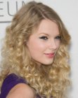 Taylor Swift wearing her hair long with lots of small curls