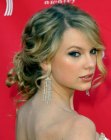 Taylor Swift's curled up-style with a loose knot