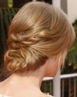 Taylor Swift with her hair pinned into a low updo
