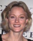 Teri Polo with her hair cut short and styled out of her face