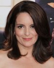Tina Fey wearing a shoulder length haistyle with side swept bangs
